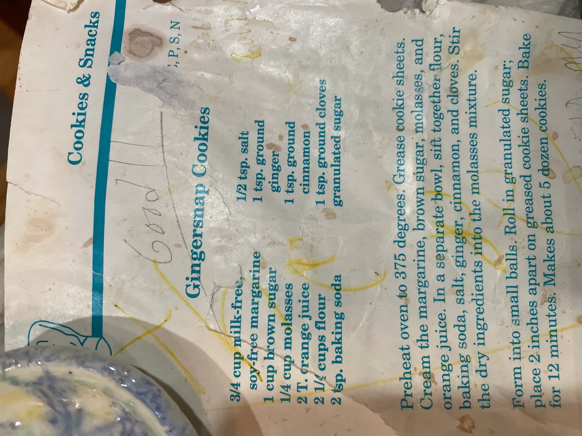 A stained, dog-eared recipe card titled Gingersnap Cookies from the Cookies and Snacks section, with the word good handwritten across it in pen